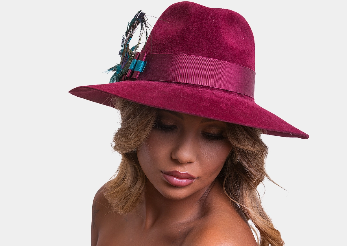 A woman wearing a red hat in autumn